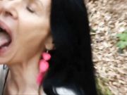 Mature lady filmed swallowing cock and sperm of young man outdoor