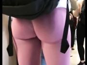 Candid camera blonde chick reveals her sexy body in tight pink leggings
