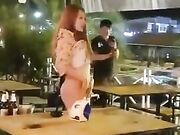 Thailand woman performer flashing cunt and butt in public bar