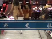 Asian woman goes shopping totally naked in the store