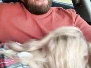Partner receives a oral stimulation in car from spouse while driving